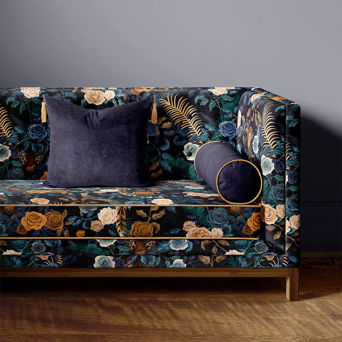 Sofa upholstered with Bengal Rose Garden velvet fabric in dark blue and floral print by Designer, Becca Who