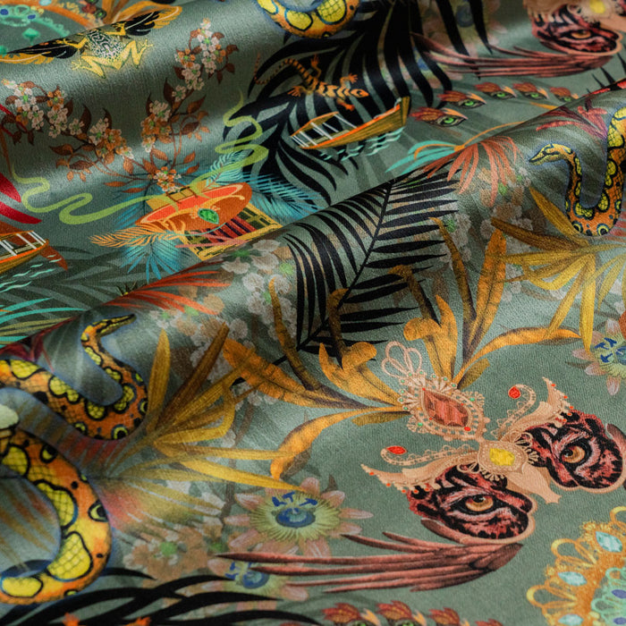 Amazon Trip jade green jungle print designer velvet fabric by Becca Who, with a jaguar, macaws, rainbow boas and monkeys