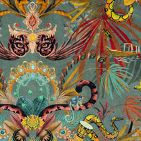 Close-up of jaguar, monkeys and rainbow boas among tropical flowers on Amazon Trip jungle print velvet fabric in jade green