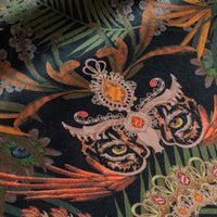 Close-up of the jaguar on Amazon Trip black and gold patterned velvet upholstery fabric