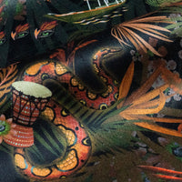 Detail of the rainbow boa on black and gold jungle print velvet furnishing fabric