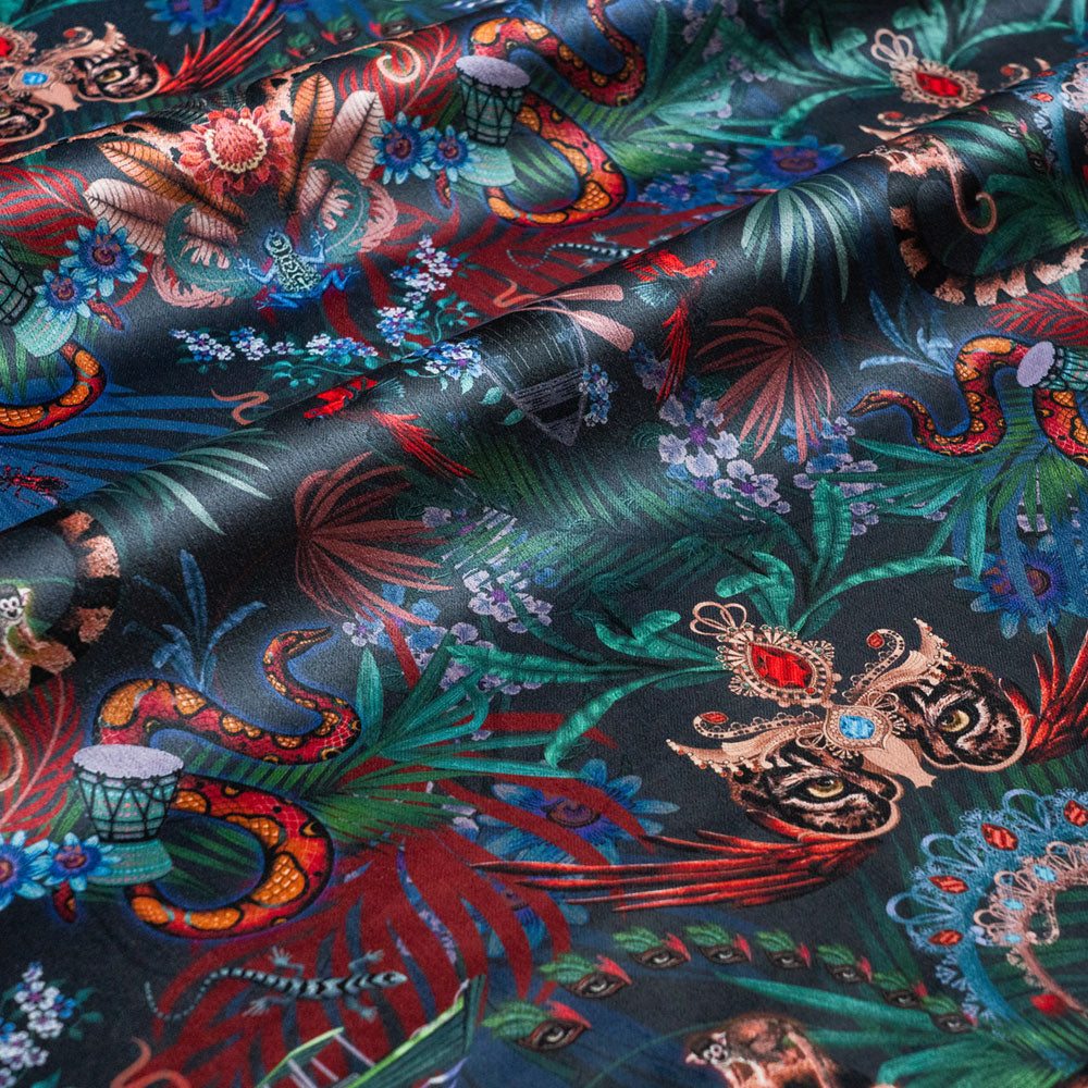Amazon Trip midnight blue velvet fabric draped in soft folds, showing how the jungle print falls for curtains and blinds