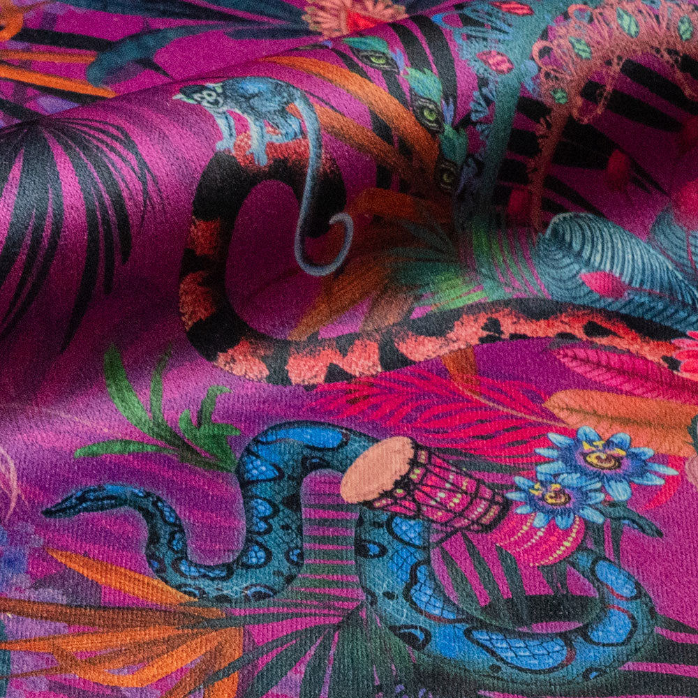 Detail of the macaws and rainbow boa on violet jungle print velvet furnishing fabric