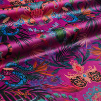 Amazon Trip violet velvet fabric draped in soft folds, showing how the jungle print falls for curtains and blinds