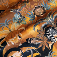 Close-up of hot air balloons and African animals print velvet fabric in mustard yellow