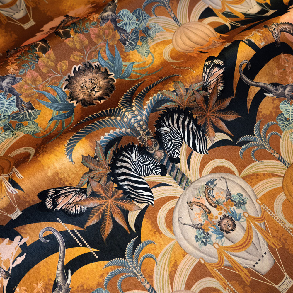 Rippled lengths of Balloon Safari mustard yellow African animal print velvet fabric for upholstery and cushions