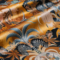 Balloon Safari mustard yellow velvet fabric draped in soft folds, showing how the African animal print falls for curtains and blinds