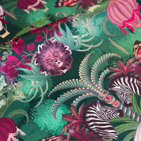 Close-up of the zebras and lion on Balloon Safari emerald green patterned velvet upholstery fabric