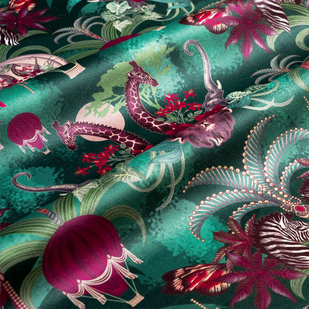 Rippled lengths of Balloon Safari emerald green African animal print velvet fabric for upholstery and cushions