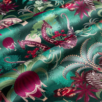 Rippled lengths of Balloon Safari emerald green African animal print velvet fabric for upholstery and cushions