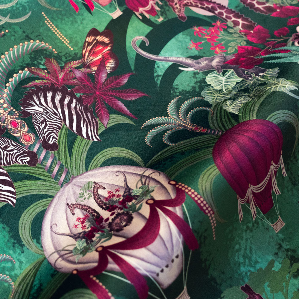 Balloon Safari emerald green velvet fabric draped in soft folds, showing how the African animal print falls for curtains and blinds