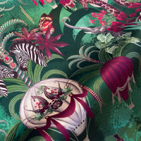 Balloon Safari emerald green velvet fabric draped in soft folds, showing how the African animal print falls for curtains and blinds