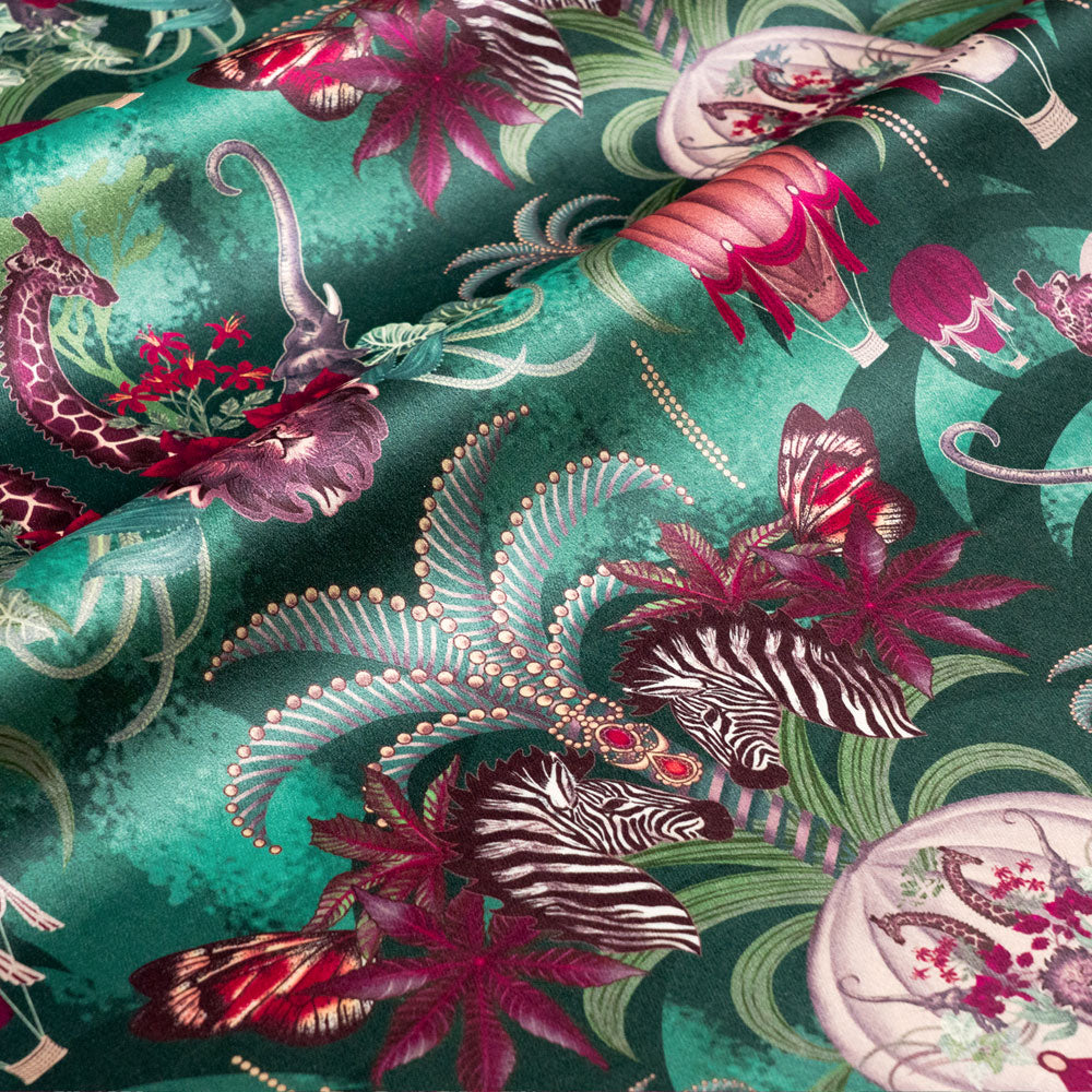 Balloon Safari velvet fabric in emerald green photographed at an angle to show the subtle sheen