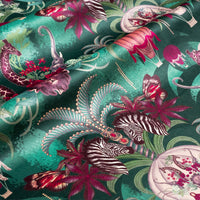 Balloon Safari velvet fabric in emerald green photographed at an angle to show the subtle sheen