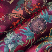 Close-up of the lion on Balloon Safari pink and claret patterned velvet upholstery fabric