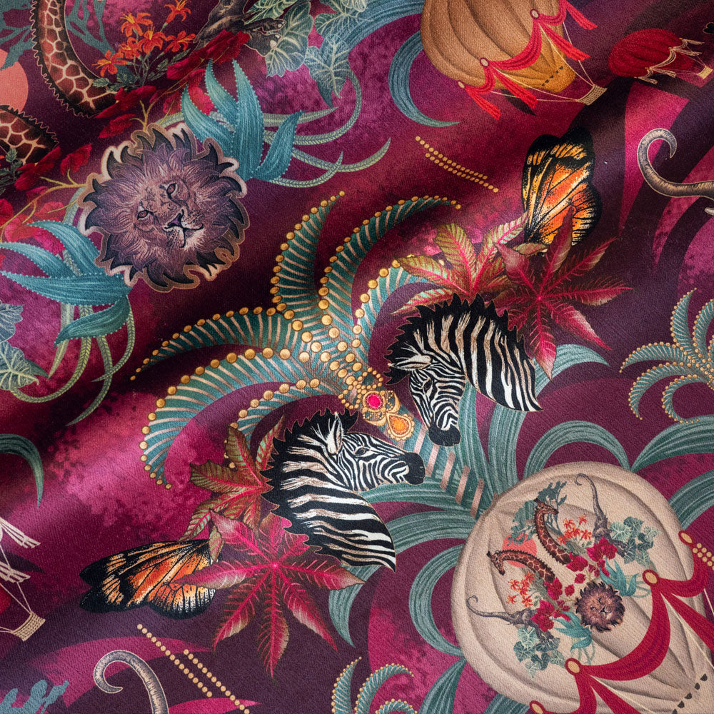 Balloon Safari pink and claret velvet fabric draped in soft folds, showing how the animal print falls for curtains and blinds