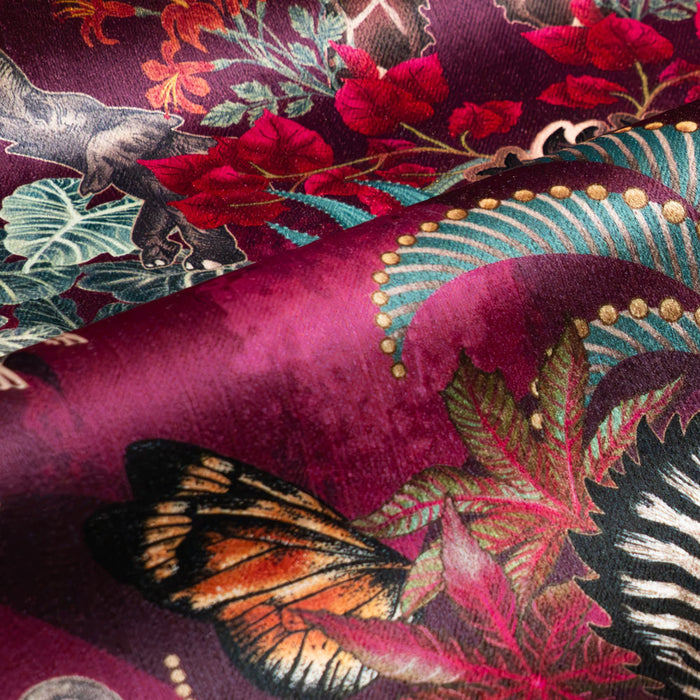 Balloon Safari velvet fabric in pink and claret photographed at an angle to show the subtle sheen