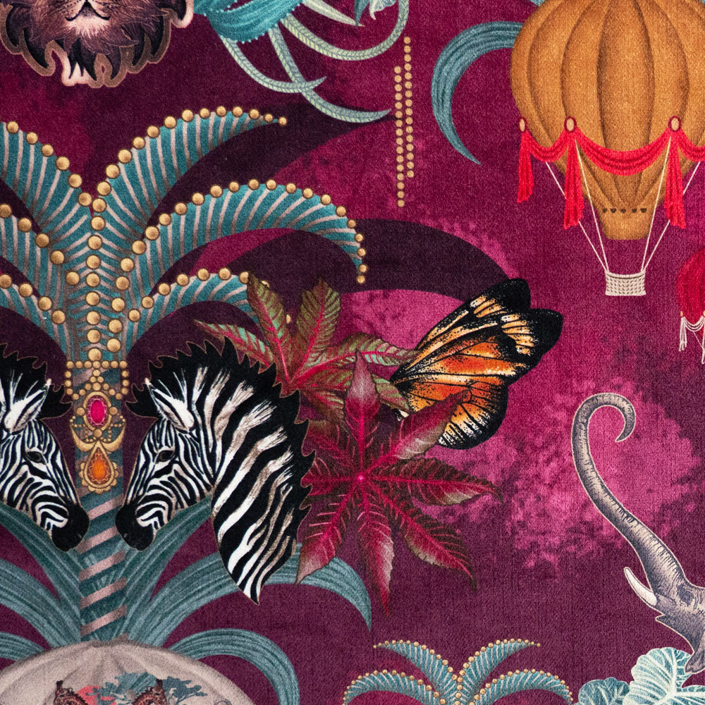 Detail of the zebras on pink and claret animal print velvet furnishing fabric