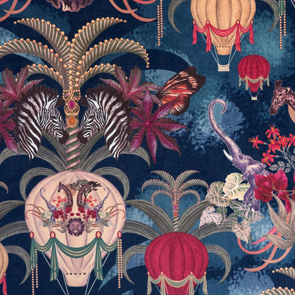 Close-up of hot air balloons and African animals printed velvet fabric in sapphire blue