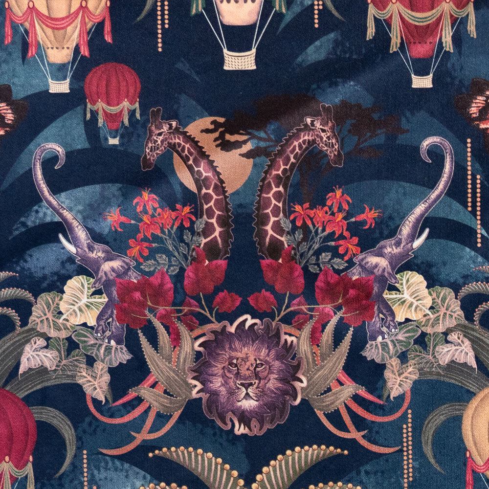Close-up of the lion, elephants and giraffes on Balloon Safari sapphire blue patterned velvet upholstery fabric