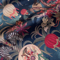 Rippled lengths of Balloon Safari sapphire blue African animal print velvet fabric for upholstery and cushions