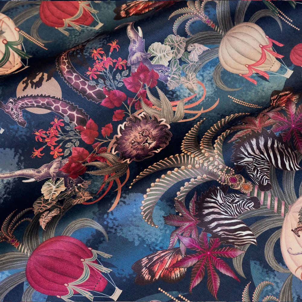 Balloon Safari sapphire blue velvet fabric draped in soft folds, showing how the African animal print falls for curtains and blinds