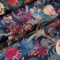 Balloon Safari sapphire blue velvet fabric draped in soft folds, showing how the African animal print falls for curtains and blinds