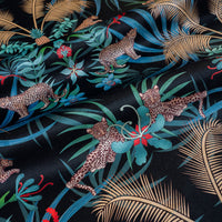 Leopard Luxe black and gold ornamental pattern designer velvet fabric by Becca Who, with leaping and lazing big cats among palms