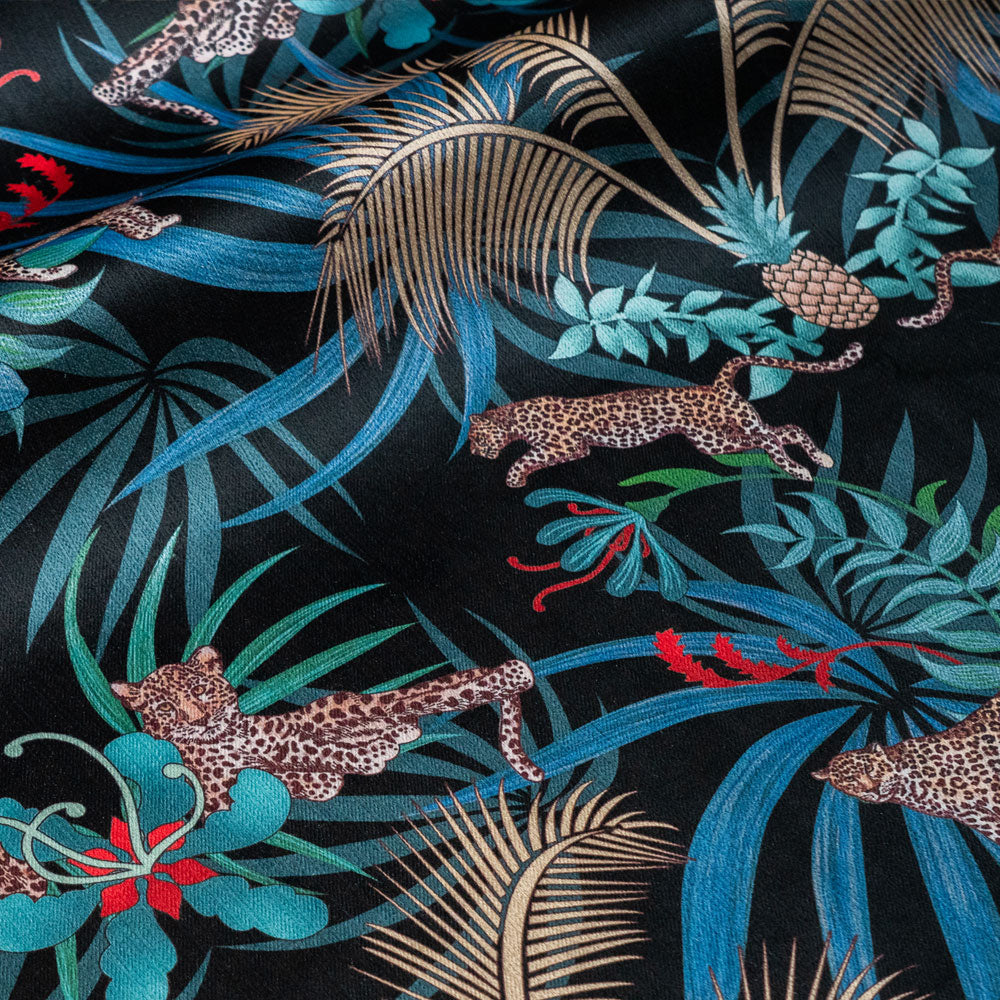 Leopard Luxe velvet fabric in black and gold photographed at an angle to show the subtle sheen