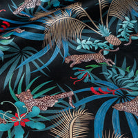 Leopard Luxe velvet fabric in black and gold photographed at an angle to show the subtle sheen