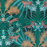 Detail of the leopards artwork pattern on green and gold ornamental pattern velvet furnishing fabric
