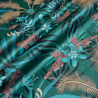 Leopard Luxe green and gold ornamental pattern designer velvet fabric by Becca Who, with leaping and lazing big cats among palms