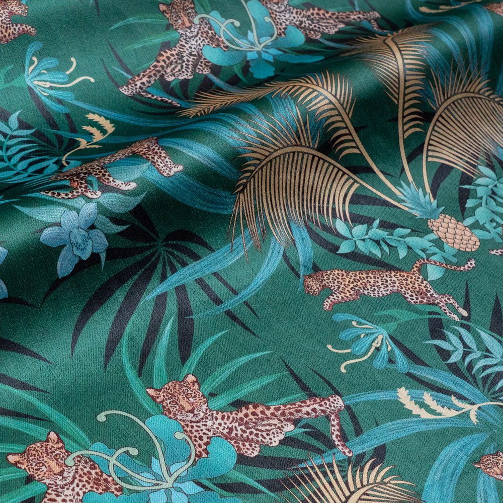 Leopard Luxe green and gold velvet fabric draped in soft folds, showing how the ornamental pattern falls for curtains and blinds