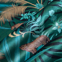 Soft velvet pile and fine print detail on green and gold ornamental pattern fabric