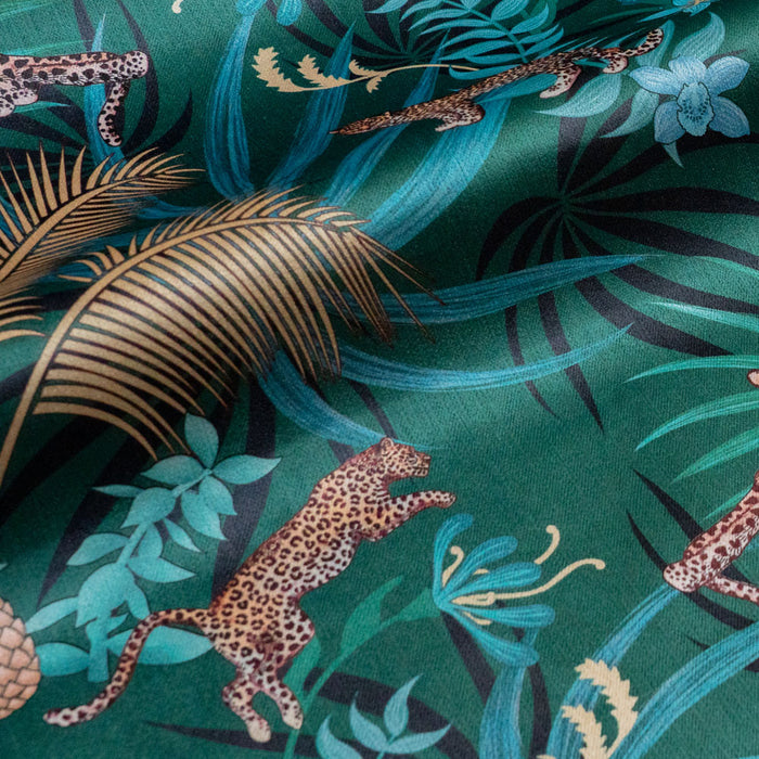 Leopard Luxe velvet fabric in green and gold photographed at an angle to show the subtle sheen