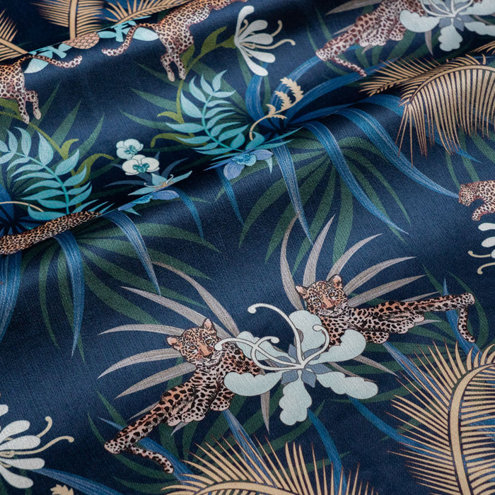 Leopard Luxe navy blue and gold pattern designer velvet fabric by Becca Who, with leaping and lazing big cats among palms