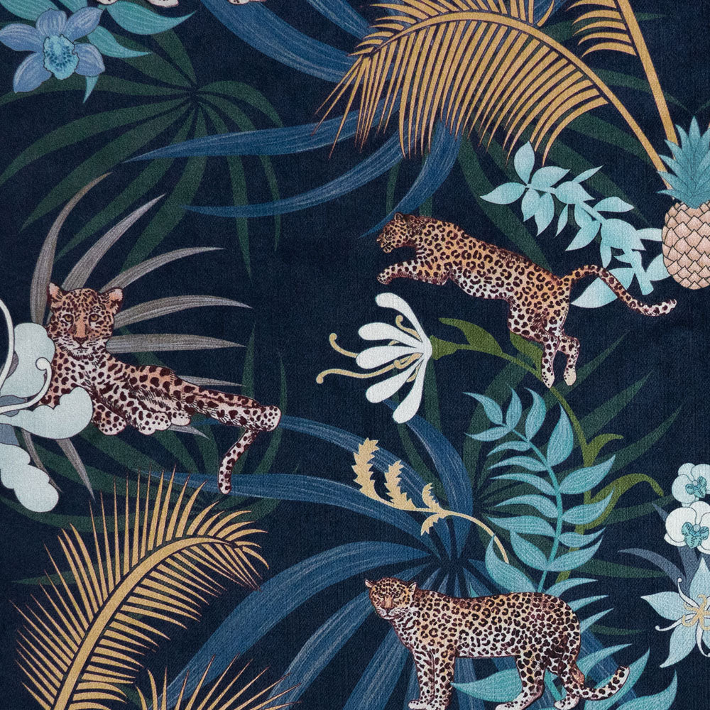 Detail of the leopards pattern artwork on navy blue and gold ornamental pattern velvet furnishing fabric