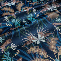 Leopard Luxe navy blue and gold velvet fabric draped in soft folds, showing how the ornamental pattern falls for curtains and blinds
