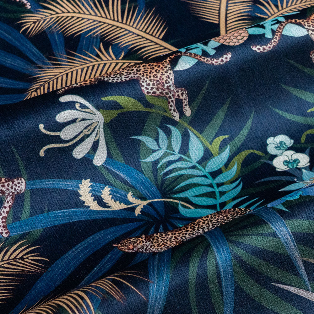 Soft velvet pile and fine print detail on navy blue and gold ornamental pattern fabric