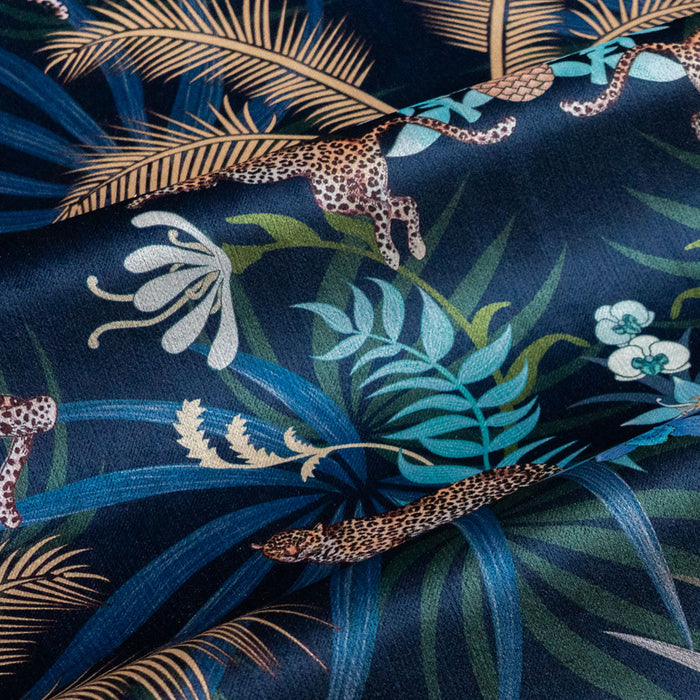 Soft velvet pile and fine print detail on navy blue and gold ornamental pattern fabric