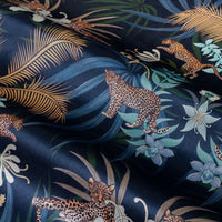 Leopard Luxe velvet fabric in navy blue and gold photographed at an angle to show the subtle sheen