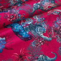 Rippled lengths of Magic Of India bright pink Indian wildlife print velvet fabric for upholstery and cushions