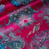 Soft velvet pile and fine print detail on bright pink Indian wildlife print fabric