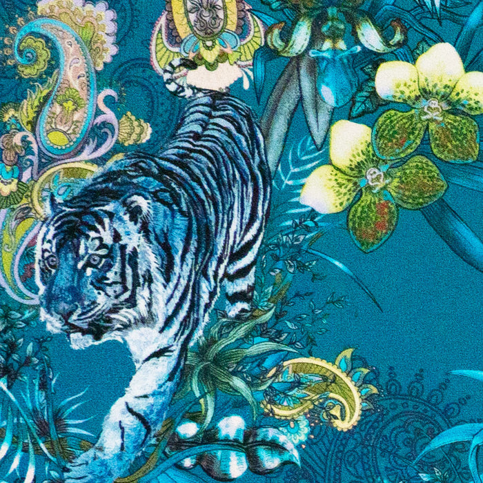 Detail of the Bengal tiger on teal blue Indian wildlife print velvet furnishing fabric