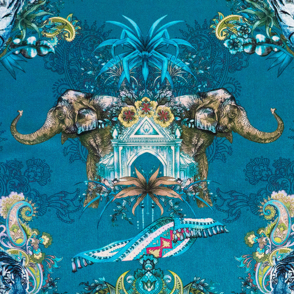 Close-up of elephant and paisley detailing on Magic Of India Indian wildlife print velvet fabric in teal blue