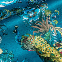 Close-up of the peacock on Magic Of India teal blue patterned velvet upholstery fabric