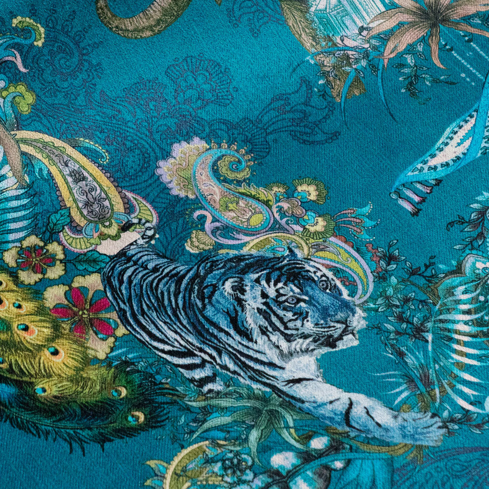 Magic Of India teal blue velvet fabric draped in soft folds, showing how the Indian wildlife print falls for curtains and blinds