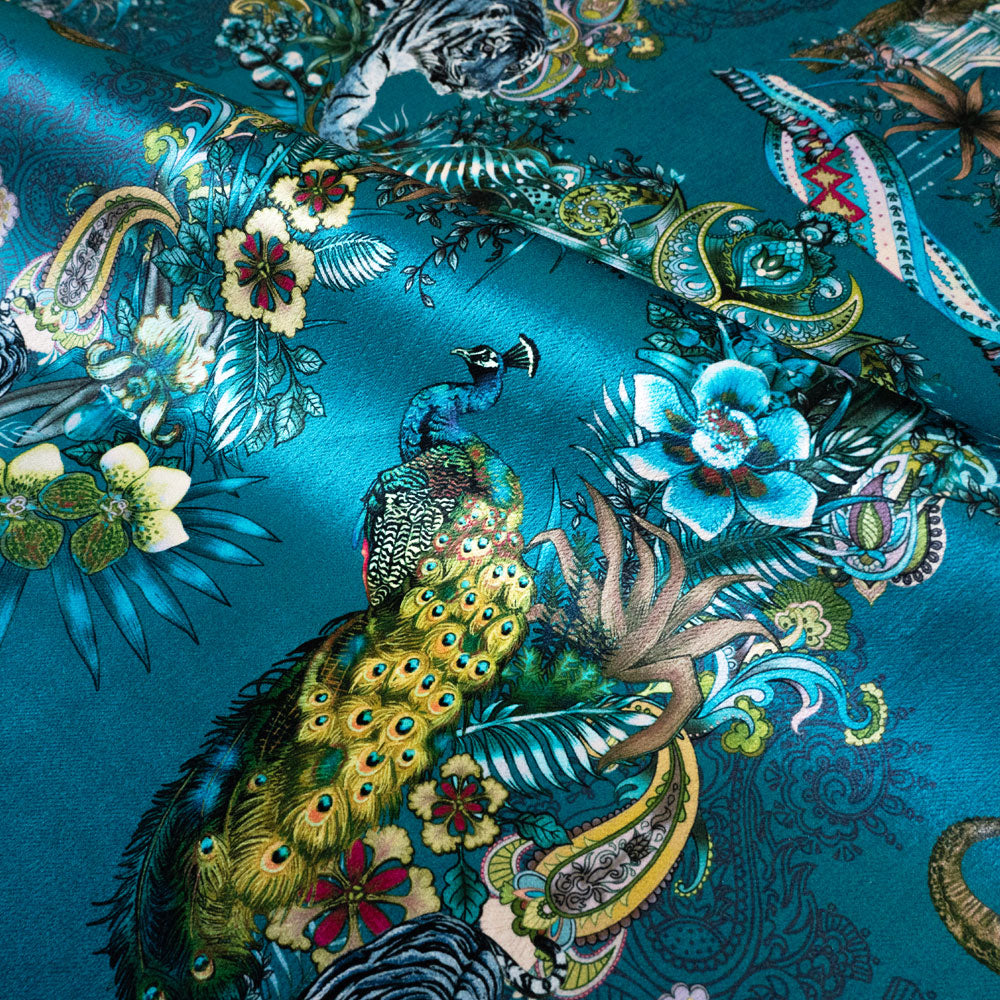 Magic Of India velvet fabric in teal blue photographed at an angle to show the subtle sheen