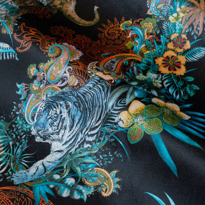 Detail of the Bengal tiger on black Indian wildlife print velvet furnishing fabric