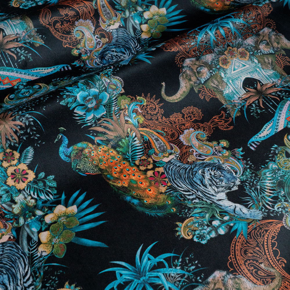 Magic Of India black Indian wildlife print designer velvet fabric by Becca Who, with a peacock, Bengal tigers and elephants with paisley detailing
